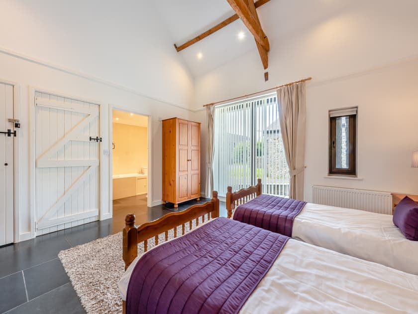 Twin bedroom | Rhandir Long House - Cennen Cottages at Rhandir Farm, Trapp, near Llandeilo