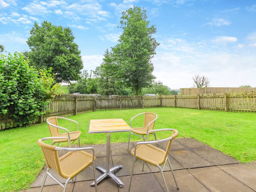 Garden | Cartmel Cottage - Meathop Fell Caravan Club Apartments and Cottage, Meathop, near Grange-over-Sands