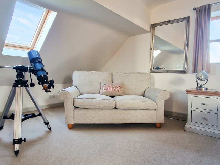 Telescope, seating area and kitchenette in large Annex bedroom  | Green Lane Cottage, Aberhafesp, near Newtown
