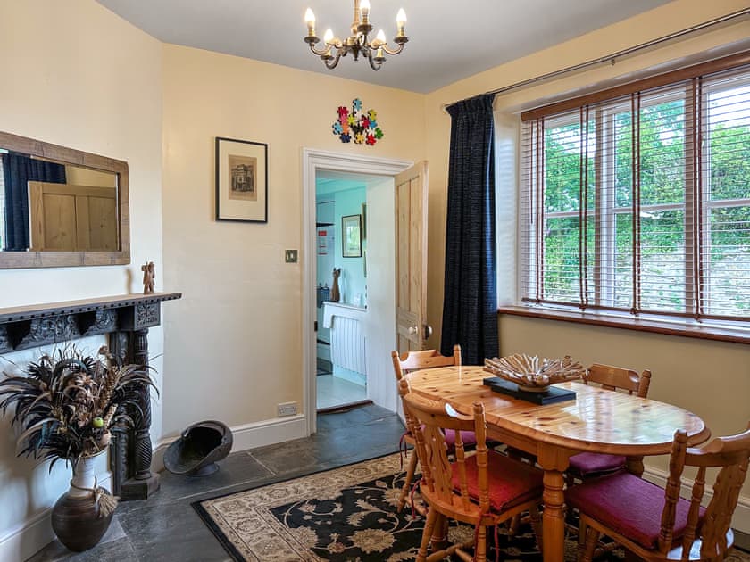 Spacious dining room adjacent to the kitchen, with original Delabole slate floor | The Headmaster’s Cottage, South Hill, near Tamar Valley