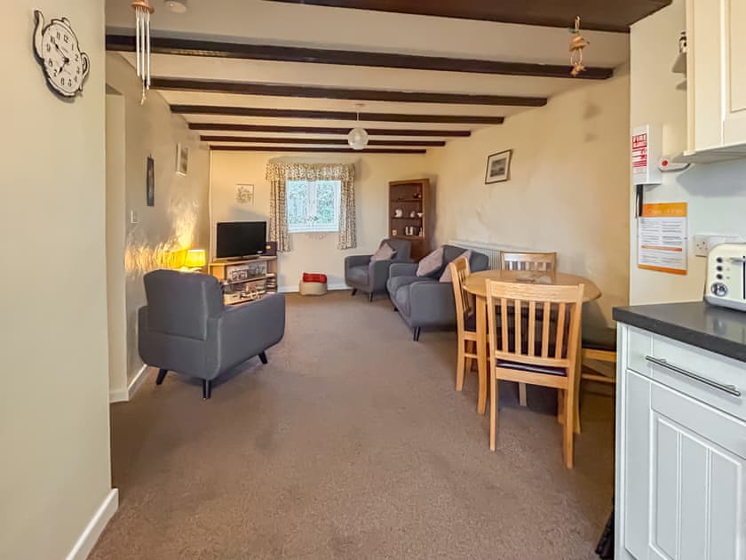 Open plan living space with living, dining and kitchen areas | Ty Main Cottage, Newborough, near Llangefni