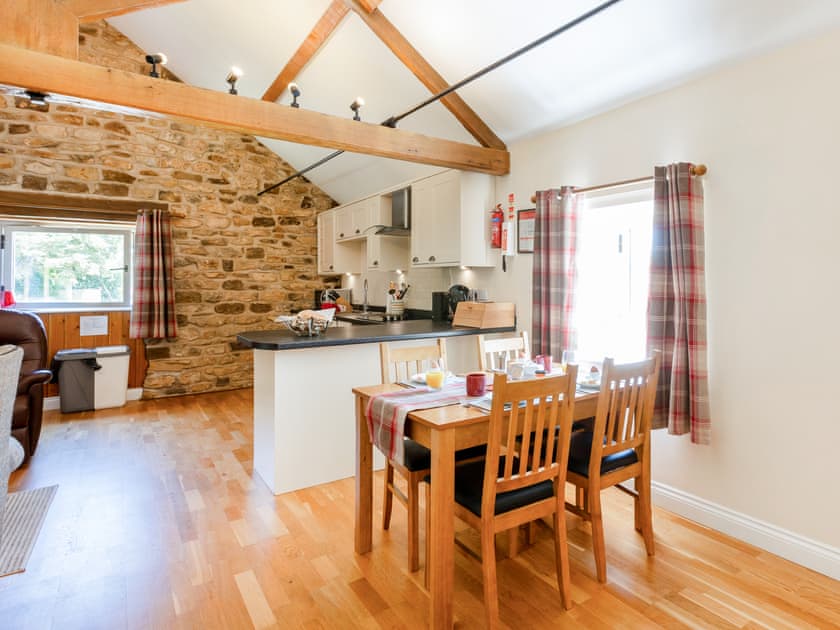 Spacious living area with vaulted ceilings and exposed beams | Holly Cottage, Harwood Dale, near Scarborough