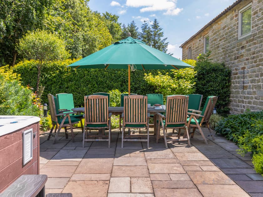 Outdoor dining area on paved patio | Sycamore Cottage, Harwood Dale, near Scarborough