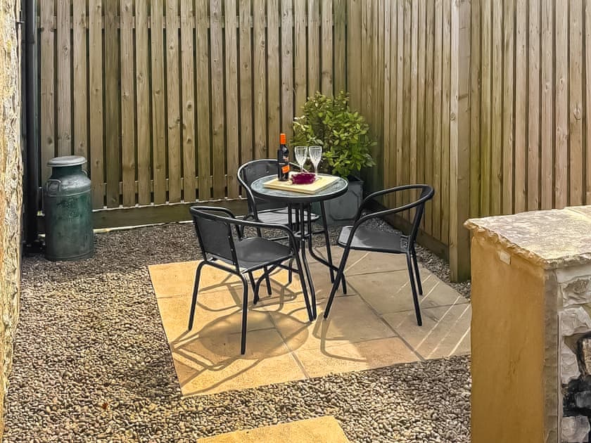 Enclosed private patio area with outdoor seating | Milking Parlour - Cotterill Farm, Biggin by Hartington, near Buxton