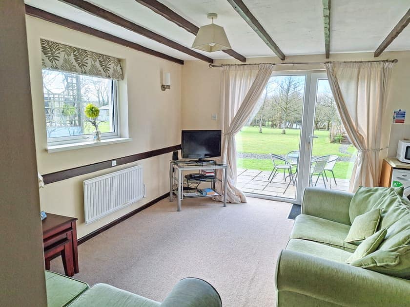 Living room | Walnut - Thornbury Holiday Park, Woodacott, near Holsworthy