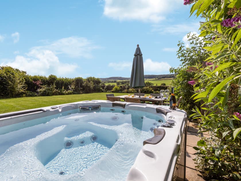 Luxurious hot tub on the patio | Mulberry Cottage, Harwood Dale, near Scarborough