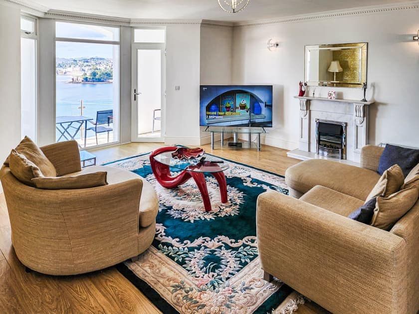 Living room with smart 65 inch TV | Riviera Apartment, Torquay