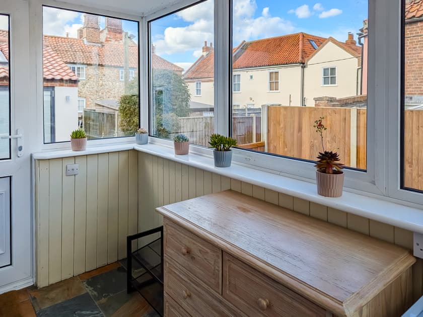 Porch with microwave oven/grill, freezer and larder fridge | Trinity Cottage, Wells-next-the-Sea