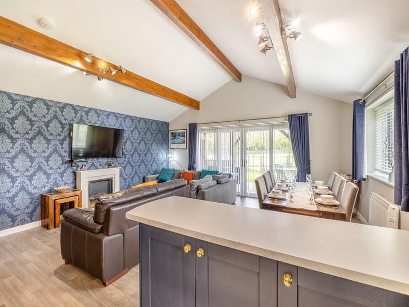 Well-appointed kitchen area with breakfast bar | Humphrey-Basil Lodge - Birchdale Lodges & Alpaca’s, Norton Disney, near Lincoln