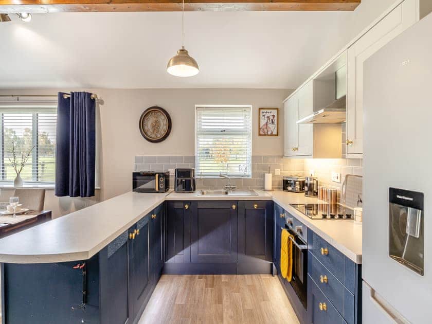 Well-appointed kitchen area with breakfast bar | Humphrey-Basil Lodge - Birchdale Lodges & Alpaca’s, Norton Disney, near Lincoln