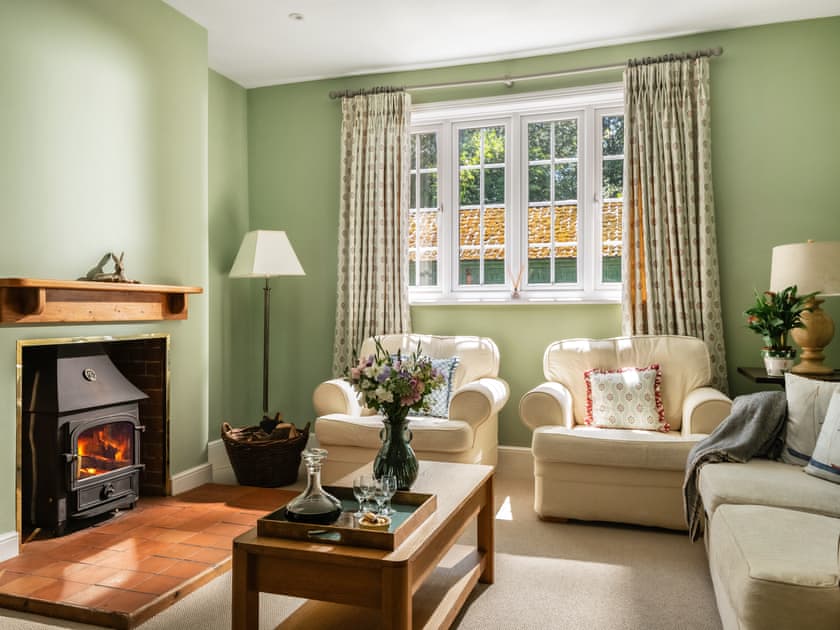 Comfortable living room with wood burner | Hall Cottage, Gresham, near Sheringham