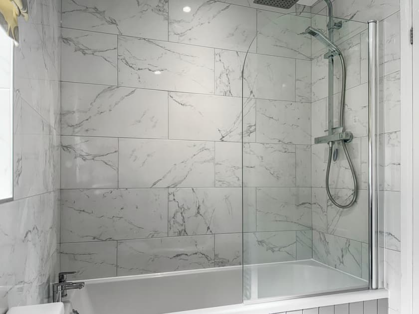 Bathroom. Bath with shower screen and overhead shower | Sleepy Willow, Little Snoring, near Fakenham