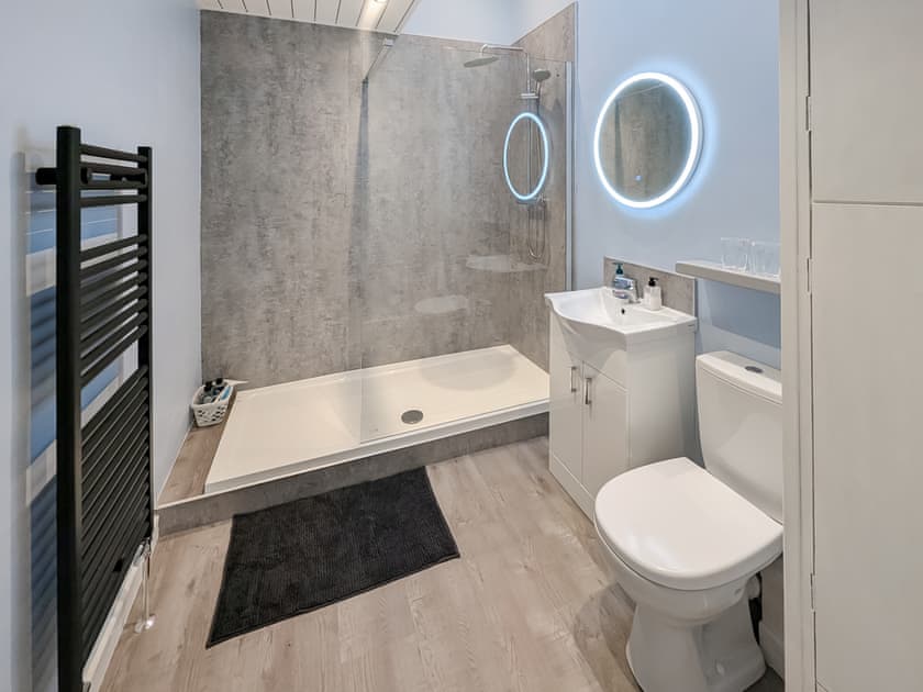 Stunning walk in shower room with heated towel rail and illuminated mirror | Delfryn, Talysarn near Caernarfon
