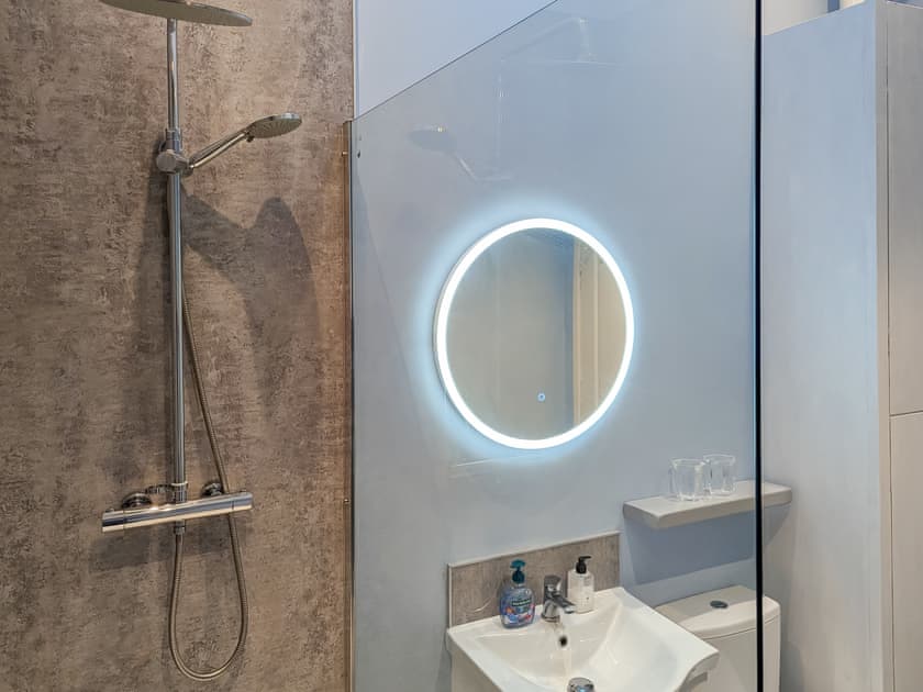 Stunning walk in shower room with heated towel rail and illuminated mirror | Delfryn, Talysarn near Caernarfon