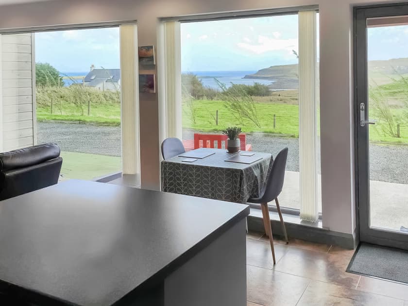 Light and airy living space with large ‘picture’ windows | Storr - Brogaig Cottages, Brogaig, near Staffin