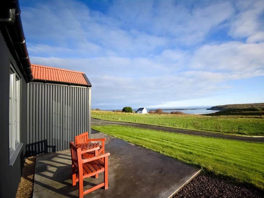 Fabulous coastal view from the patio | Storr - Brogaig Cottages, Brogaig, near Staffin