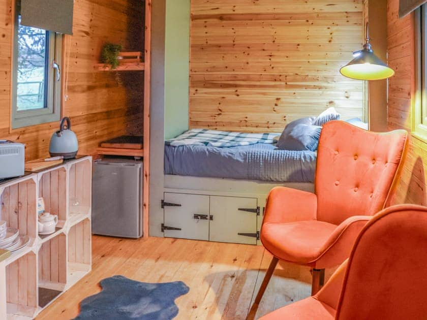 Open plan living space | Shepherds Hut One - Island Hut Retreats, Rhosmeirch, near Benllech