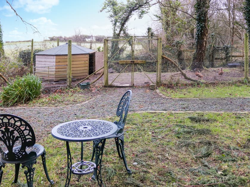 Sitting-out-area | Shepherds Hut One - Island Hut Retreats, Rhosmeirch, near Benllech