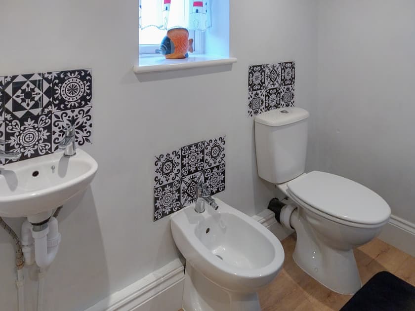 Cloakroom with w.c, bidet, handbasin, small twin tub  | Flither Cottage, Staithes, near Saltburn-by-the-Sea