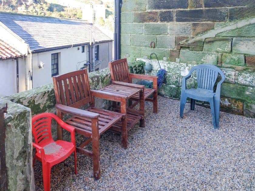 External yard with seating overlooking the beck  | Flither Cottage, Staithes, near Saltburn-by-the-Sea