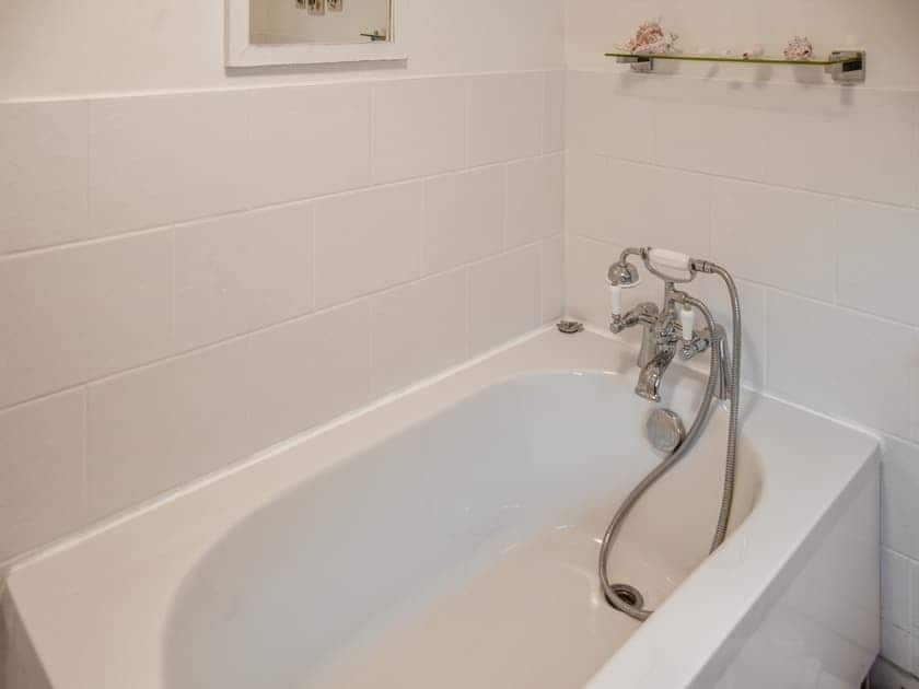 Small, sit-in bath tub | White Stones Cottage, Caister-on-Sea, near Great Yarmouth
