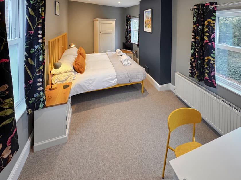 Chic bedroom with beautiful design accents | wardrobe | Dressing table | Smart TV and alarm clock | hairdryer | Ebor Cottage, York