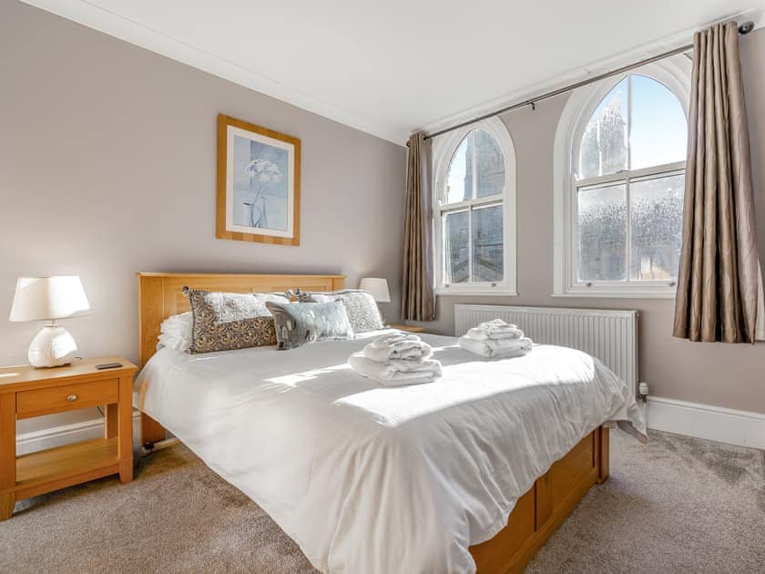Welcoming double bedroom with a fine view of St Hilda’s Church | Four Square, Whitby
