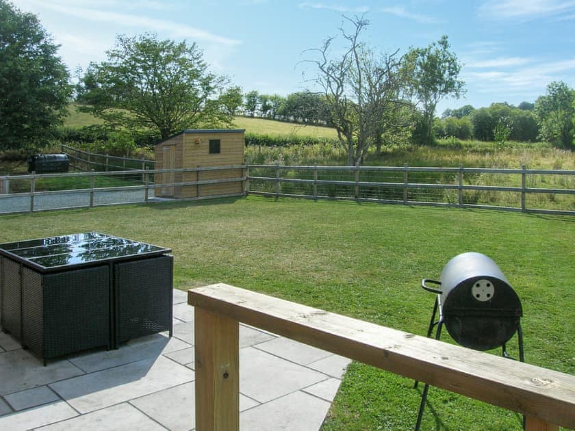 Sitting-out-area | River Lodge - Bryncoch Holidays, Hundred House, near Builth Wells