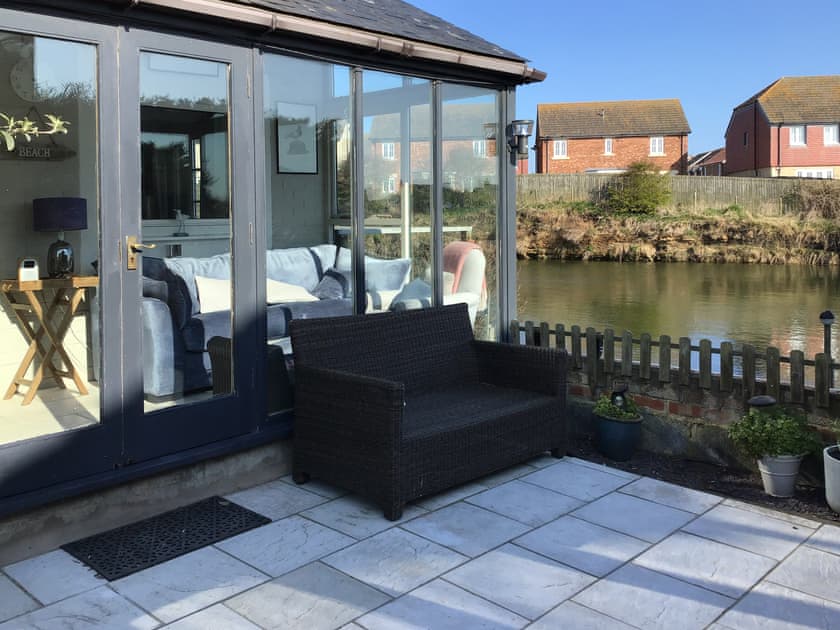 Entrance and one of 3 seating areas  | Water’s Edge Holiday Home, Beadnell