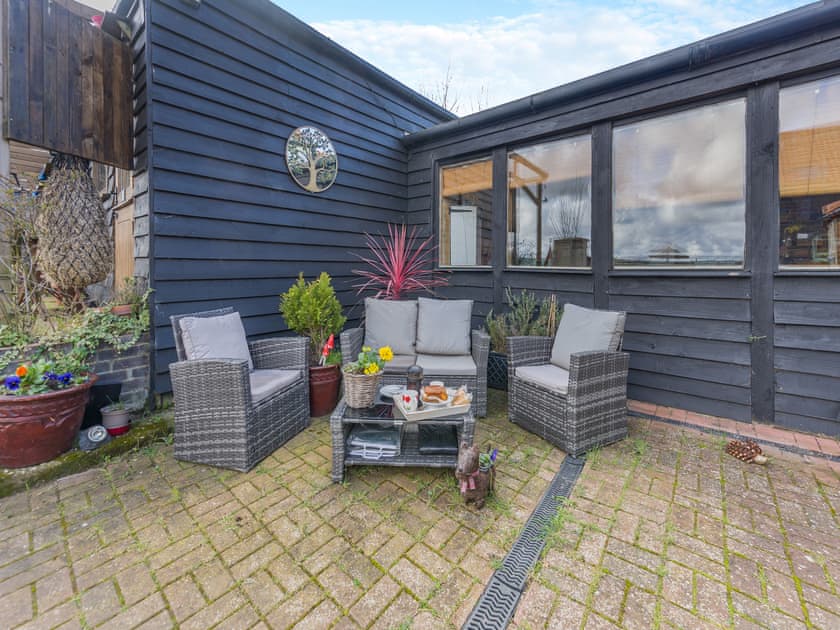 Sitting-out-area | The Old Barn - Norfolk Coastal Cottages, Heacham, near Hunstanton