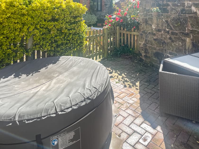 Hot tub and courtyard area | Boyne Arms Cottage, Burwarton, near Bridgnorth