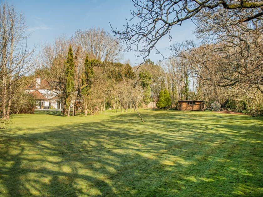 Patio area and lawned garden | Arnewood Corner, Sway, near Lymington