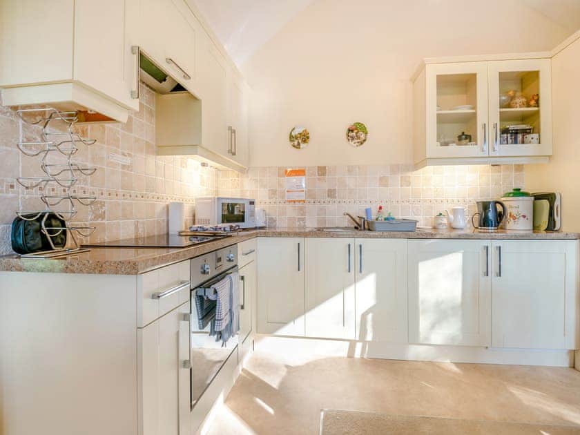 Well equipped, charming, kitchen dining area | Moorland Lodge, Holt Wood, near Wimborne