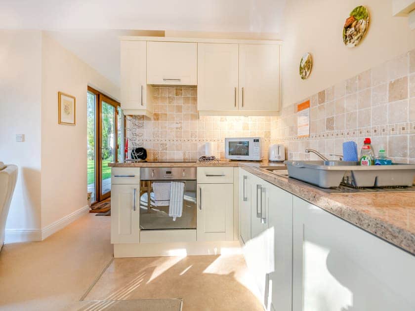 Well equipped, charming, kitchen dining area | Moorland Lodge, Holt Wood, near Wimborne