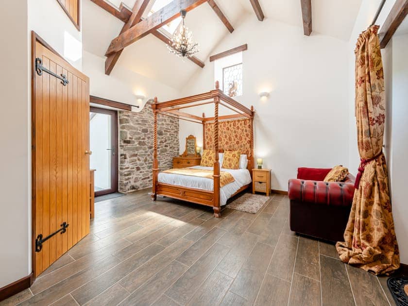 Four Poster bedroom | Wheelwright Barn - Bronyn Farm, Ferryside, near Carmarthen