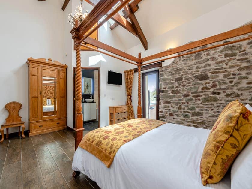 Four Poster bedroom | Wheelwright Barn - Bronyn Farm, Ferryside, near Carmarthen
