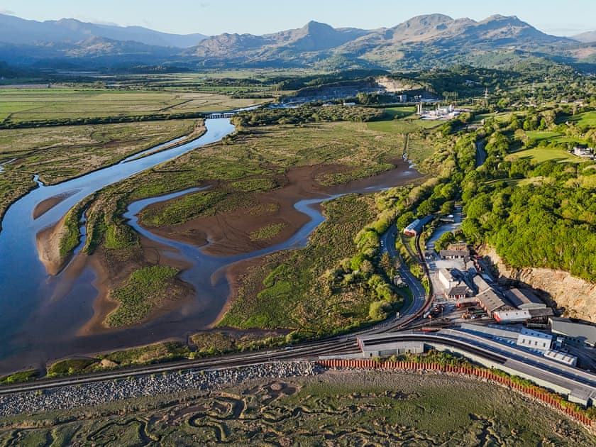 View of the estuary with the house on the hillside above Boston Lodge | Bron Madog, Minffordd, near Porthmadog