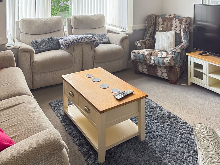 Front lounge with cozy fireplace | Lilac Villa, Skegness