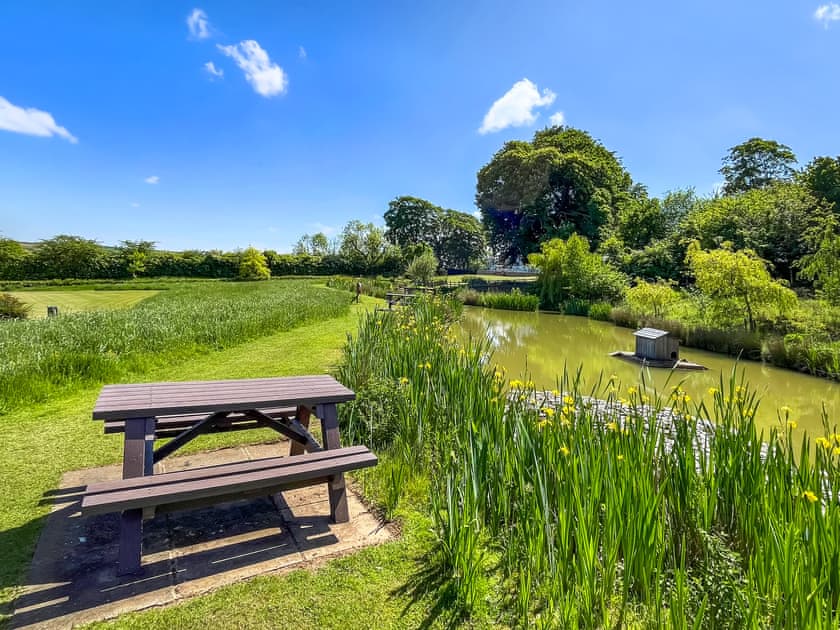 Outdoor bench seating next to Wildlife Pond in shared natual grounds at Greetham Retreat  | Roses Rest - Greetham Retreat, Greetham, near Horncastle