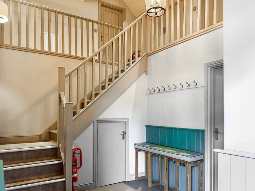 Entrance hall with understairs storage, coat rack and access to both downstairs en-suite bedrooms. NOTE: Rooms upstairs are off limits | Barn Owl Cottage - Home Farm Retreats, Kirk Hammerton, near York