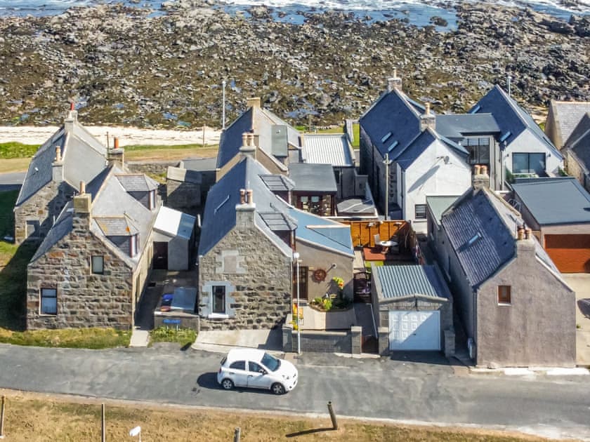 Seabreeze cottage (white car passing) is located just round the corner from the shore | Sea Breeze, Cairnbulg, near Fraserburgh