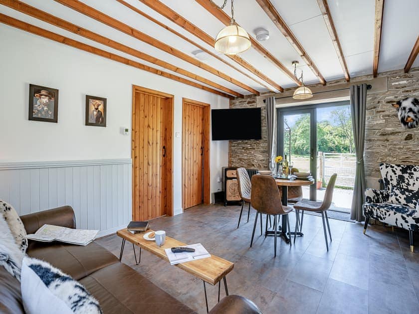 Living room/dining room | The Old Cowsheds 4 - Daniel Ddu - Gaer Cottages, Cribyn, Lampeter