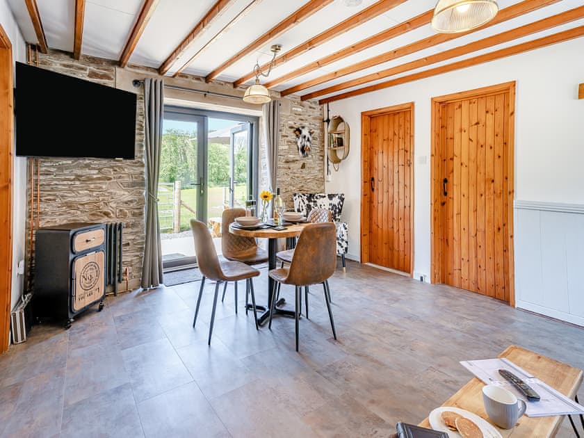 Living room/dining room | The Old Cowsheds 4 - Daniel Ddu - Gaer Cottages, Cribyn, Lampeter