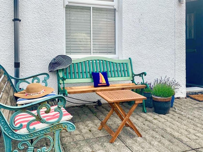 Benches to the front of the property. This spot catches the sun well into the evening | Pebble Cottage, Cullercoats, near Tynemouth