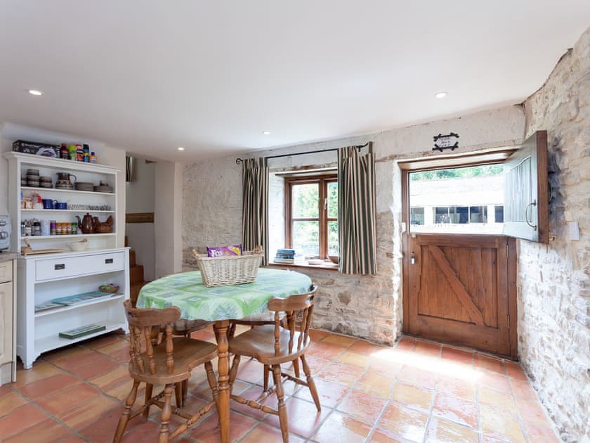 Kitche with dining table | Old Milking Parlour, Osmington, near Weymouth
