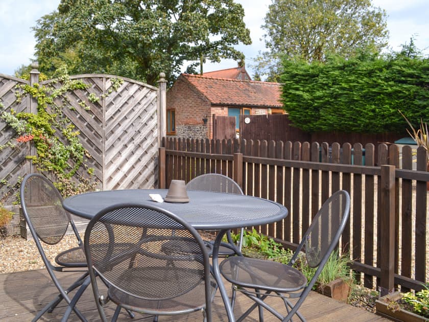 Enclosed patio area with outdoor furniture | Briarwood - Thorpewood Cottages, Thorpe Market