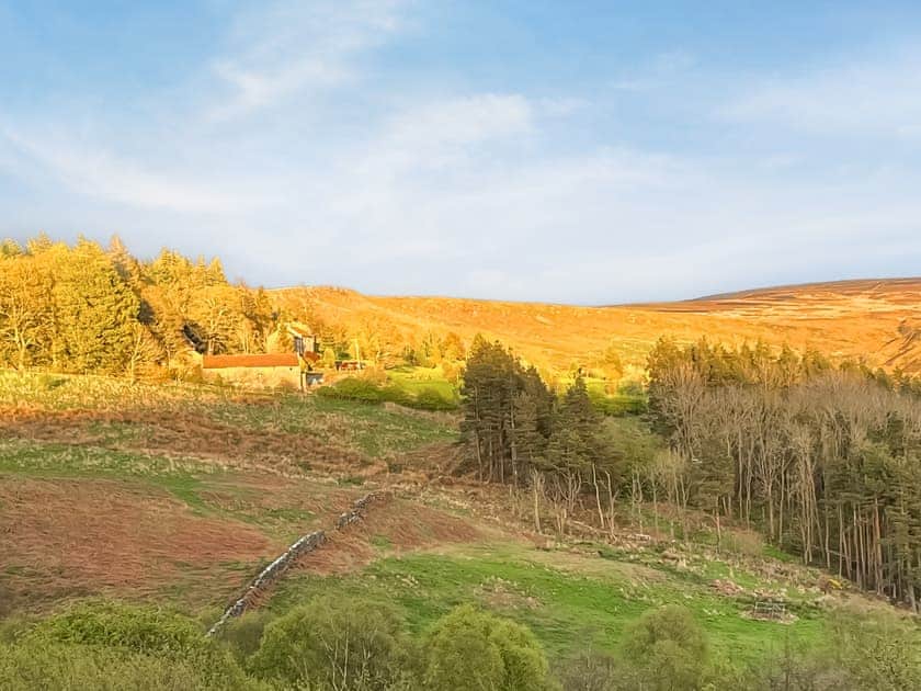 sun setting on the hills back of cottage | Crossbill Cottage, Chopgate near Stokesley