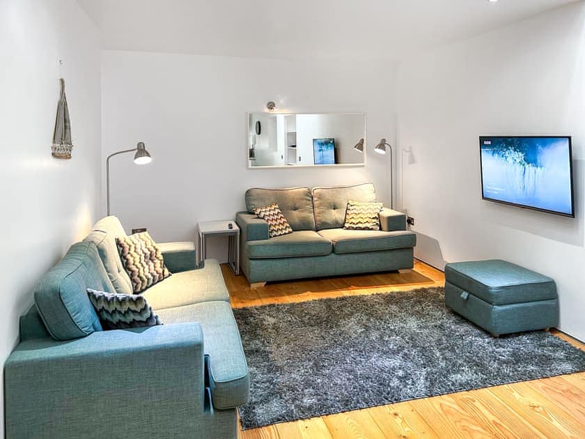 Cosy sitting area within open plan living area | The Old Smithy, Anstruther