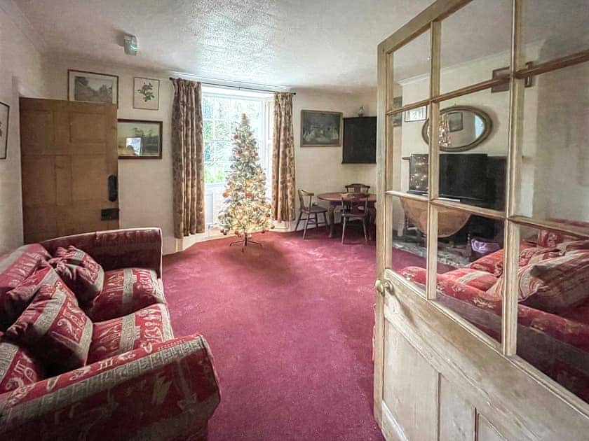 Living room with Christmas decorations | Duvale Priory - Duvale Cottages, Bampton, near Tiverton
