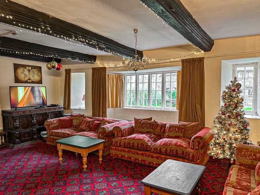 Living room with Christmas decorations | Duvale Priory - Duvale Cottages, Bampton, near Tiverton